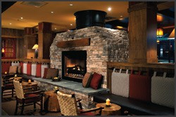 Large stone fireplace and outdoor seating area