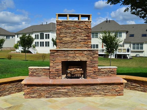 Should I Install an Outdoor Fireplace or Firepit - JT Landscaping