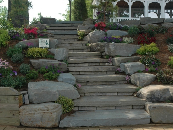 Landscape boulders on either side of stone stairs