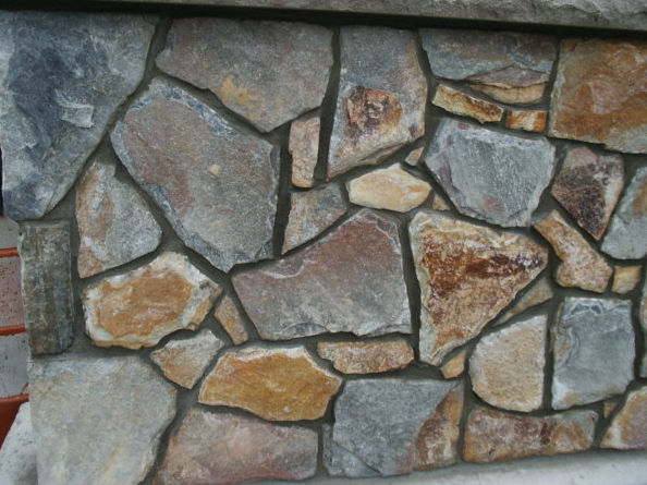 Interlocking stone blocks on a retaining wall