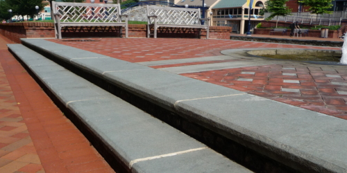 Red brick ground with grey steps